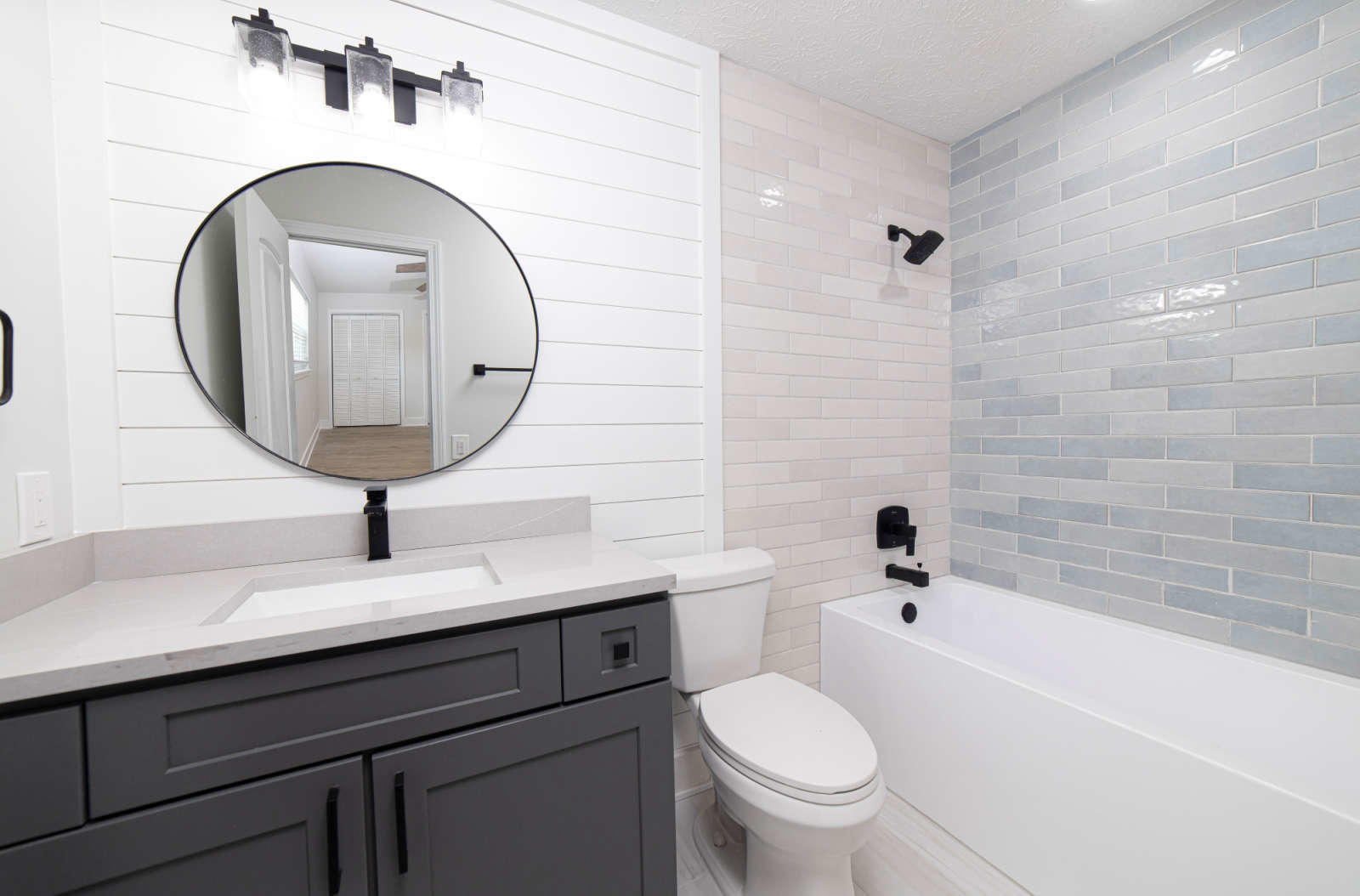 108 Linden Road St. Augustine, FL 32086 - Photo 20 of 36 a bathroom with a sink a toilet and a mirror