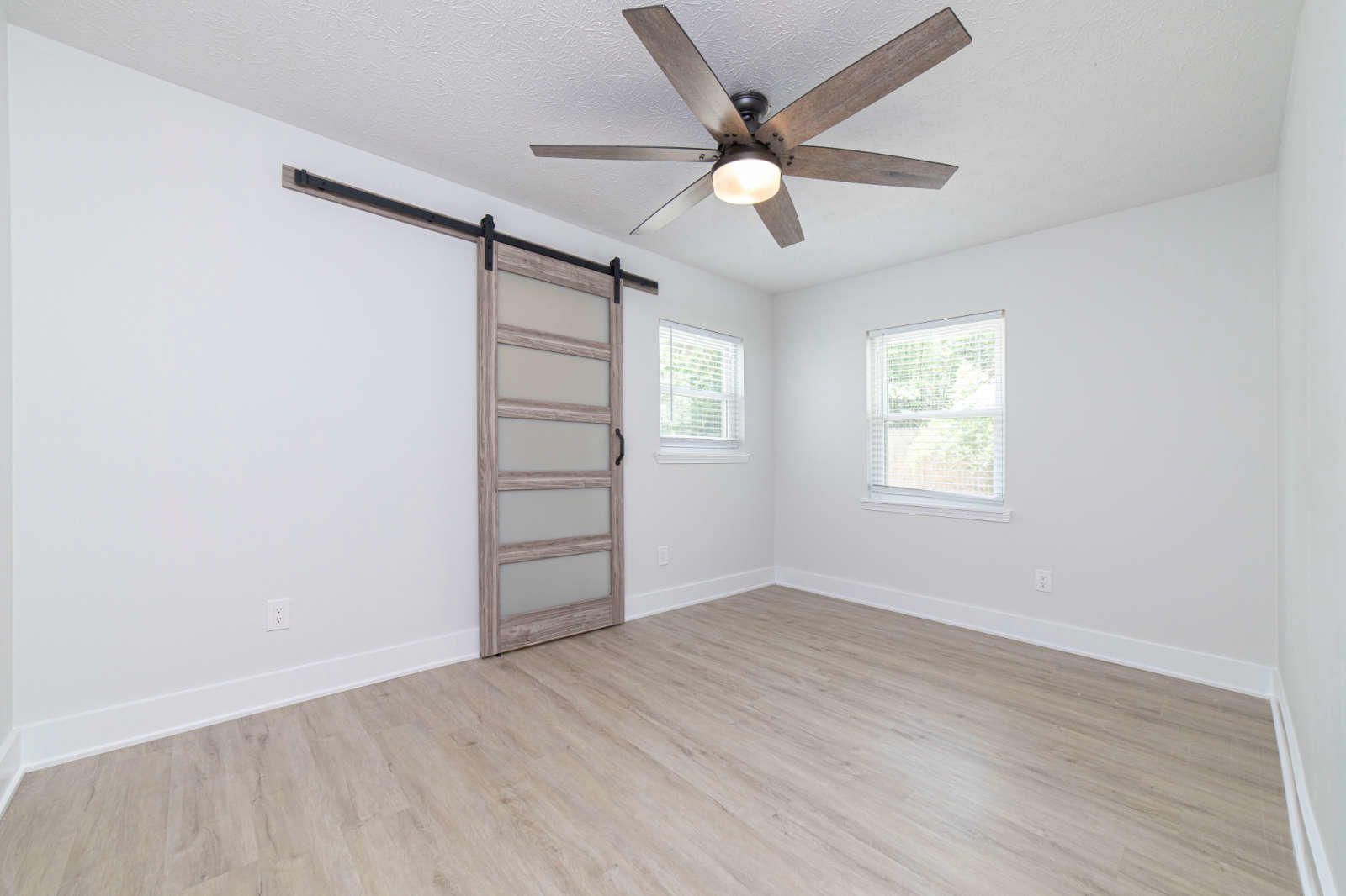 108 Linden Road St. Augustine, FL 32086 - Photo 22 of 36 an empty room with windows and fan
