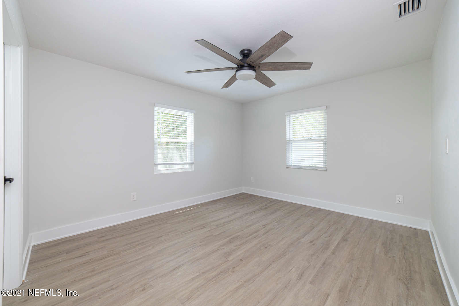 108 Linden Road St. Augustine, FL 32086 - Photo 25 of 36 a view of an empty room with wooden floor and a window