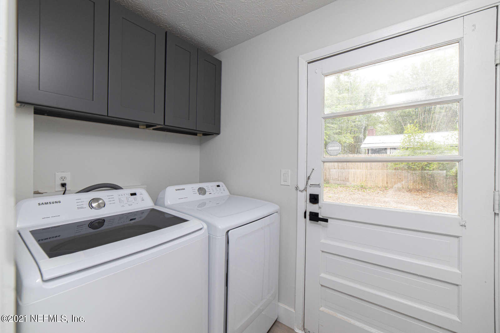 108 Linden Road St. Augustine, FL 32086 - Photo 27 of 36 a utility room with dryer and washer
