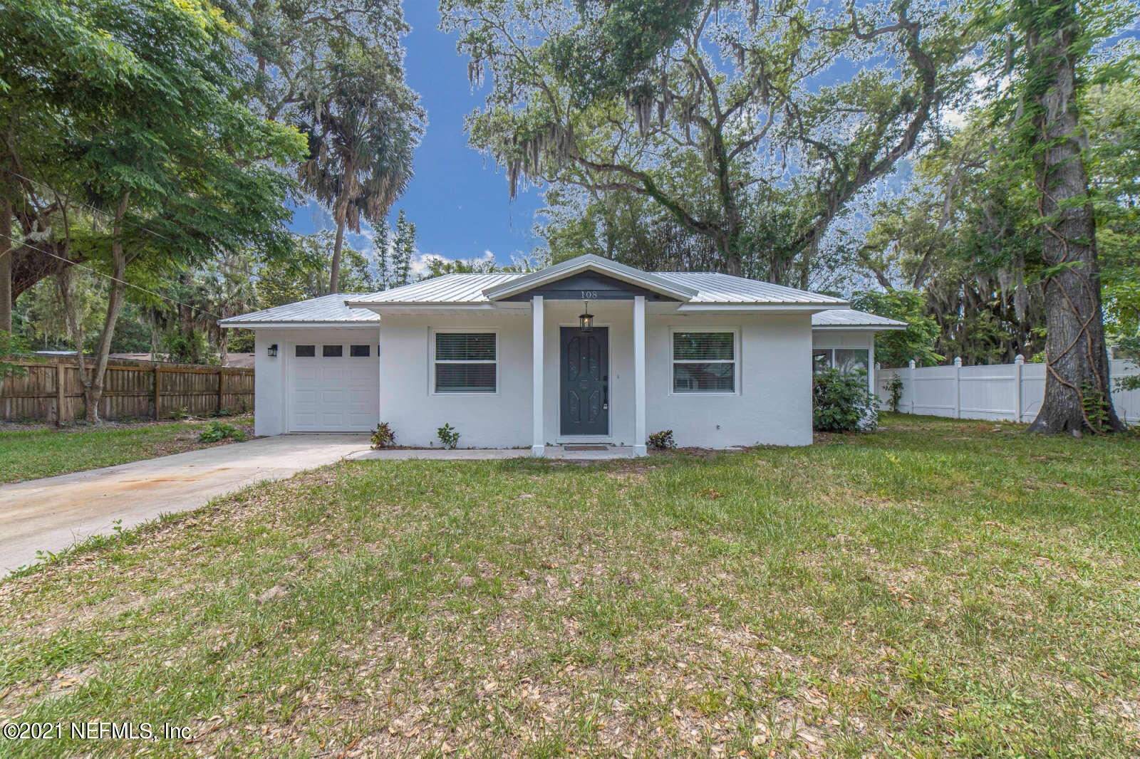 108 Linden Road St. Augustine, FL 32086 - Photo 28 of 36 front view of a house with a yard