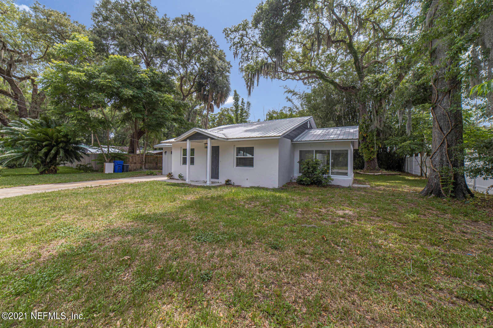 108 Linden Road St. Augustine, FL 32086 - Photo 29 of 36 a view of a house with a backyard and a large tree