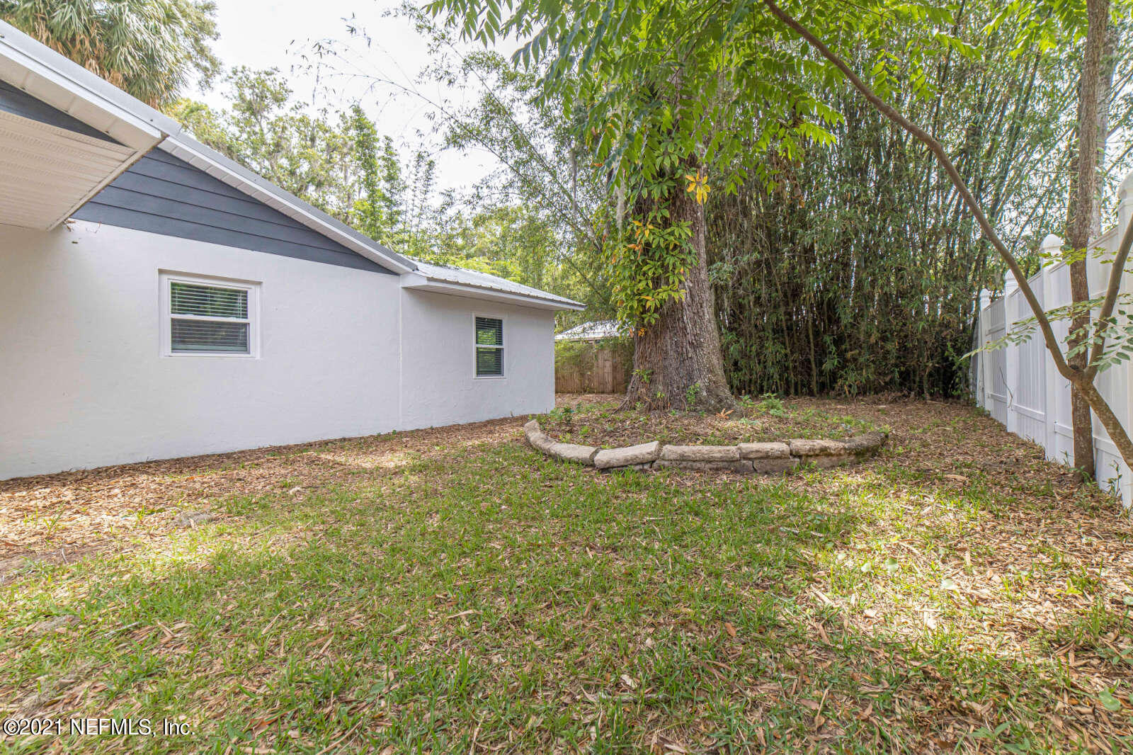108 Linden Road St. Augustine, FL 32086 - Photo 30 of 36 a view of a house with a backyard