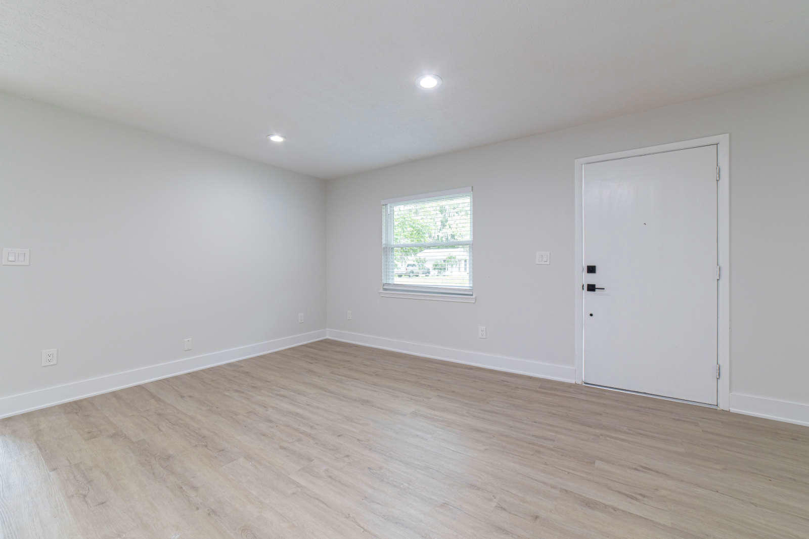108 Linden Road St. Augustine, FL 32086 - Photo 3 of 36 an empty room with wooden floor and windows