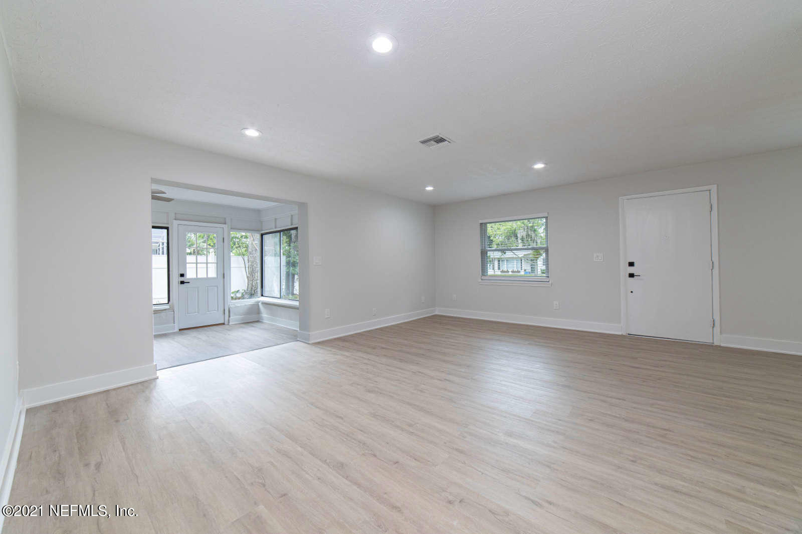 108 Linden Road St. Augustine, FL 32086 - Photo 5 of 36 an empty room with wooden floor and window