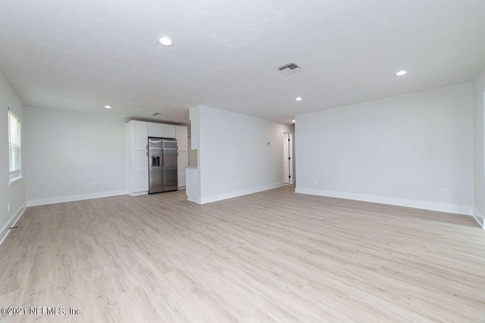 108 Linden Road St. Augustine, FL 32086 - Photo 6 of 36 an empty room with wooden floor and natural light