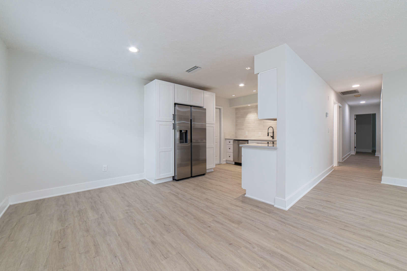 108 Linden Road St. Augustine, FL 32086 - Photo 7 of 36 a view of a kitchen with a refrigerator and a microwave