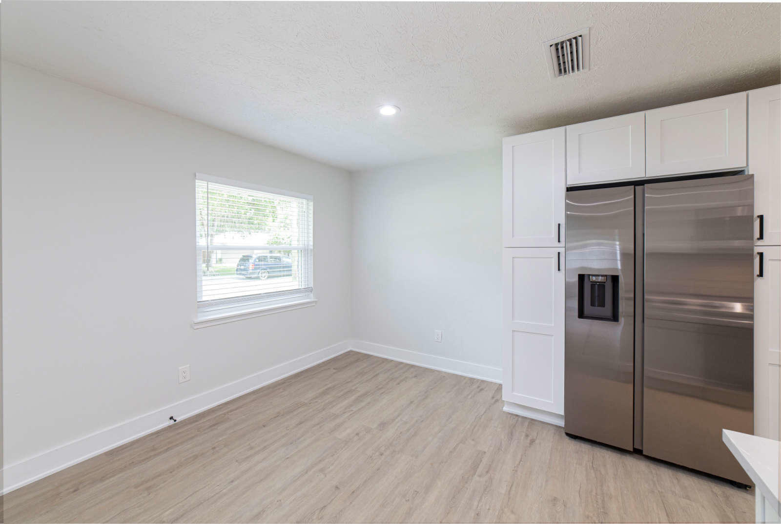 108 Linden Road St. Augustine, FL 32086 - Photo 9 of 36 a kitchen with a refrigerator and wooden floor