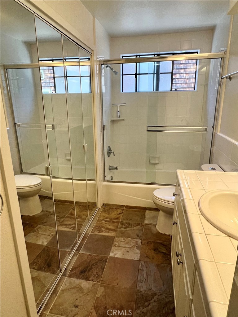 1530 Emerson Road Cambria, CA 93428 - Photo 25 of 54 Downstairs full bath with laundry behind closet doors.