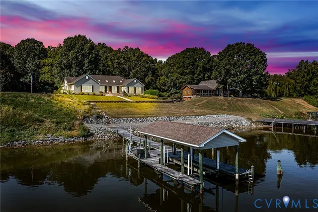 a view of a lake with a house in the background