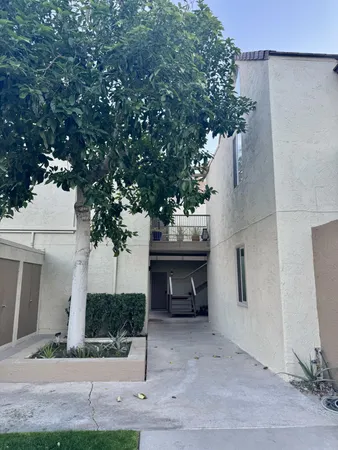 a view of a house with a yard and garage