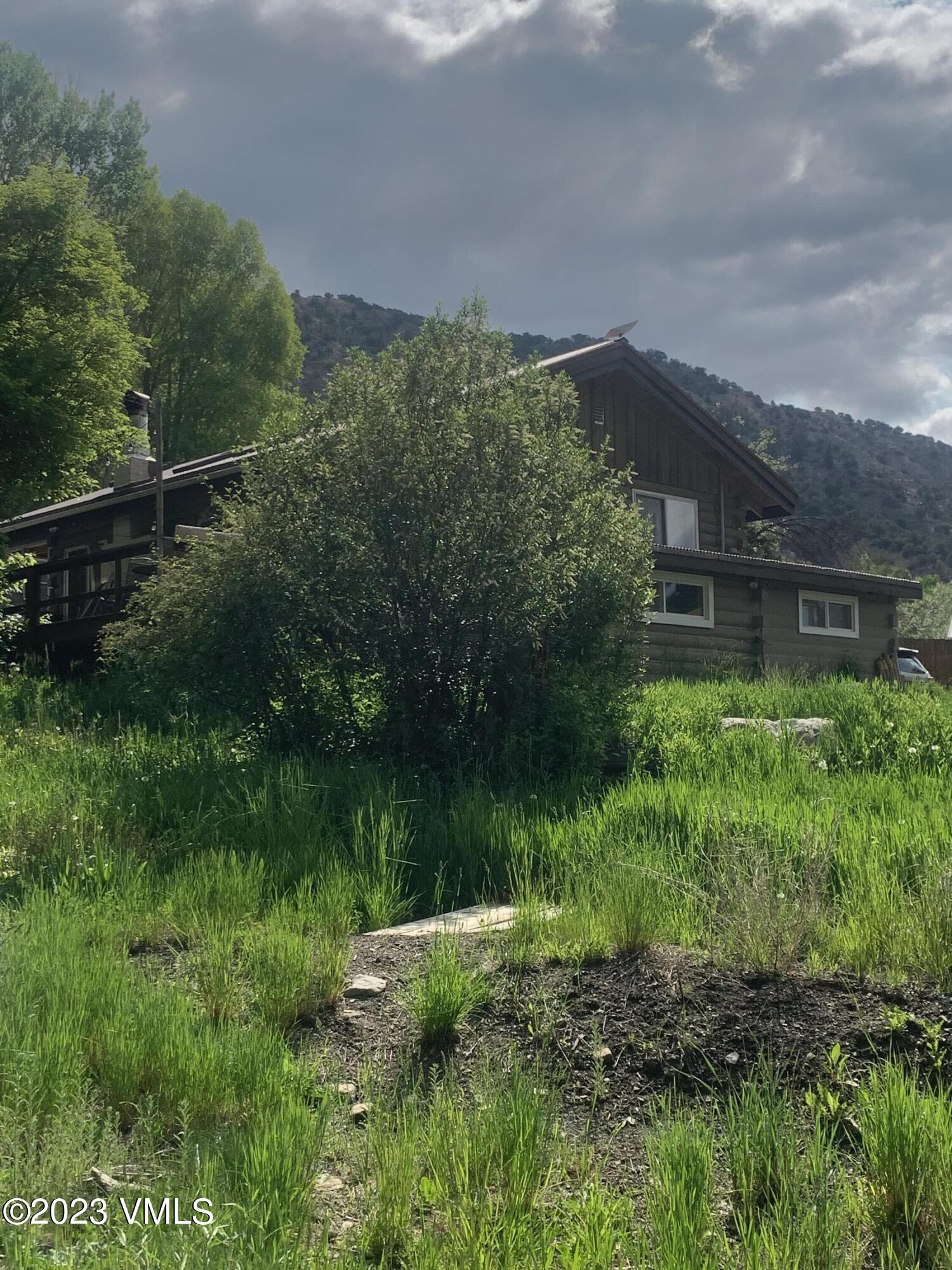 500 Sweetwater Road Gypsum, CO 81637 - Photo 8 of 10 a view of a house with a yard