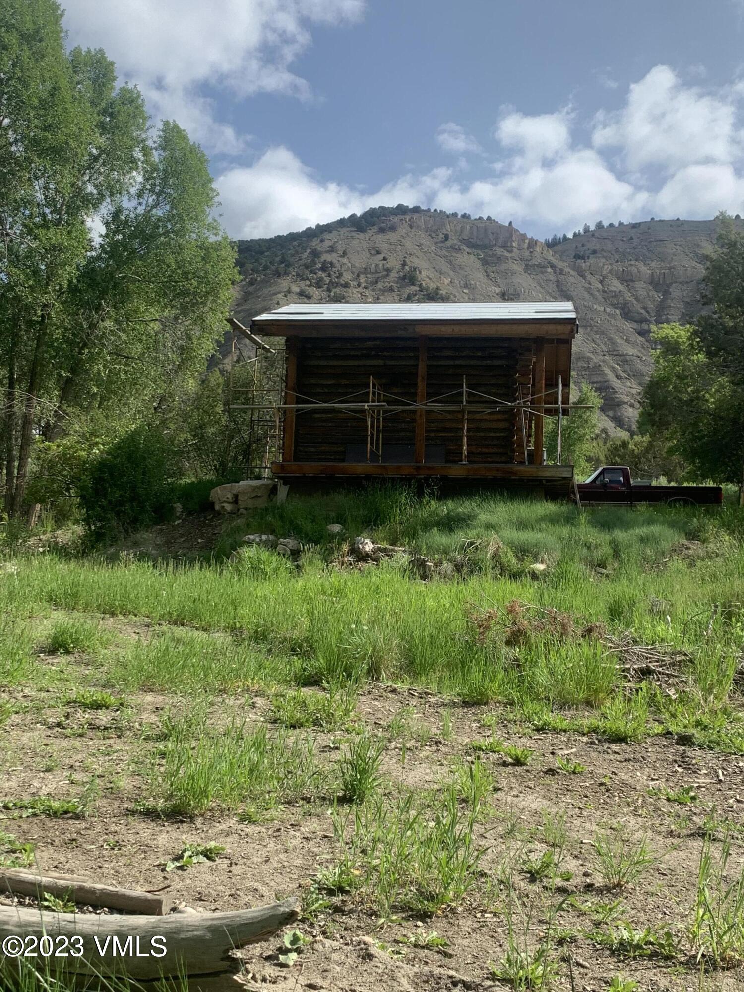 500 Sweetwater Road Gypsum, CO 81637 - Photo 9 of 10 a front view of a house with a yard