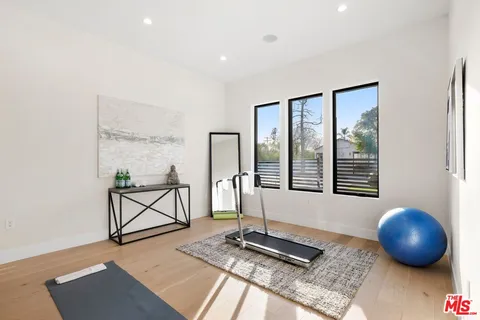 a spacious bathroom with a bathtub sink and mirror