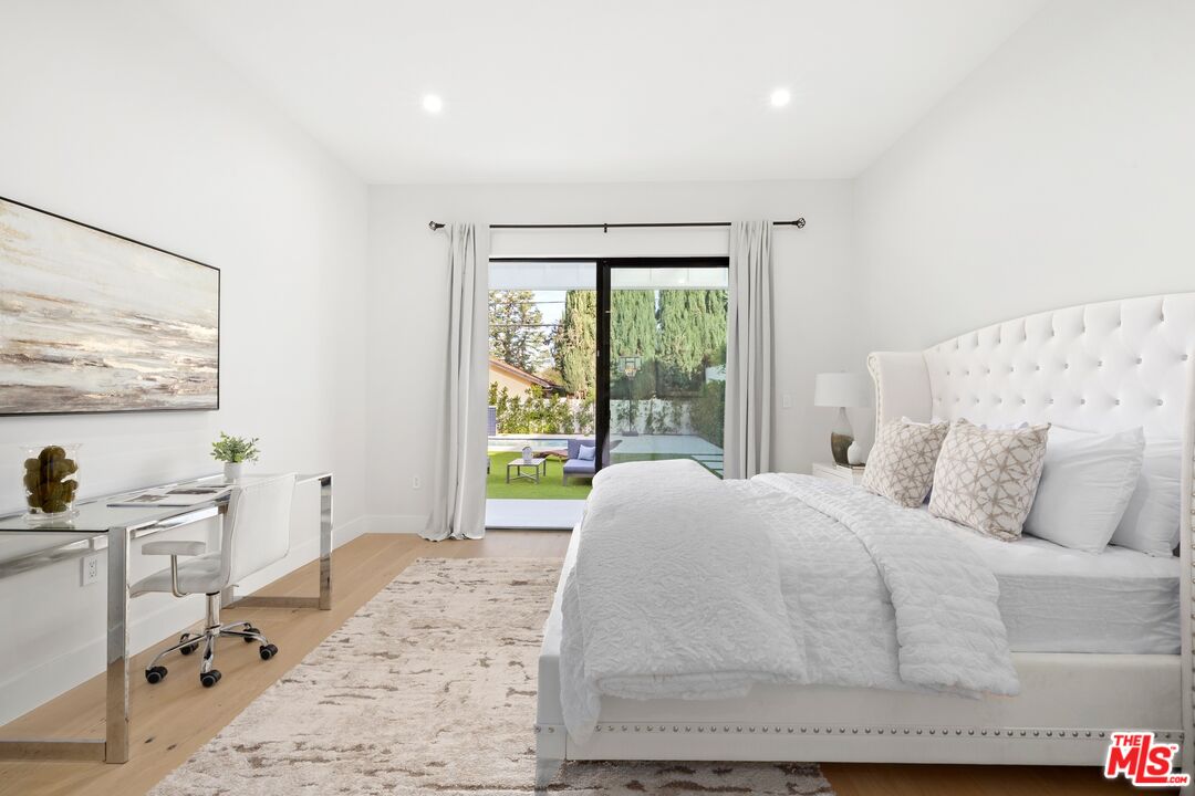 5012 Enfield Avenue Encino, CA 91316 - Photo 17 of 36 a living room with a bed furniture and next to a window
