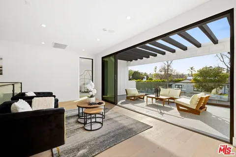 a bedroom with a bed and a table