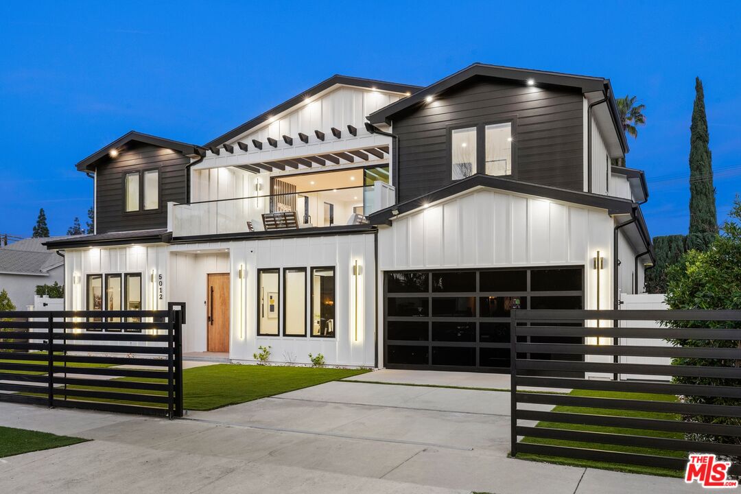 5012 Enfield Avenue Encino, CA 91316 - Photo 2 of 36 a front view of a house with a garden