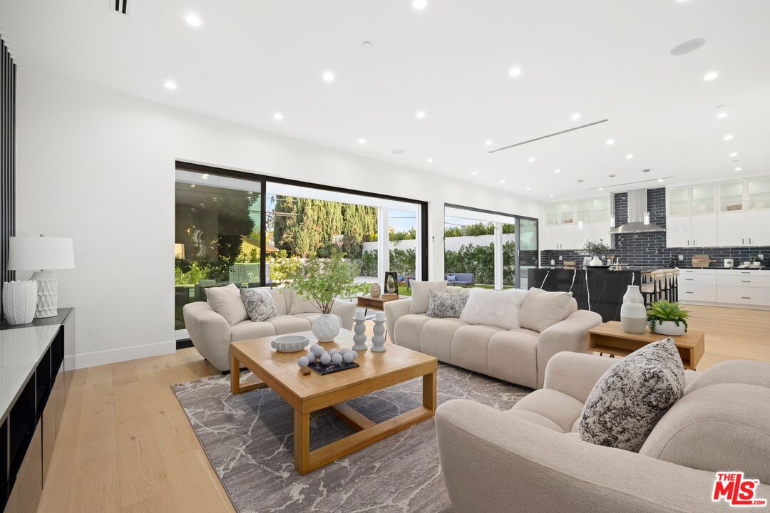 5012 Enfield Avenue Encino, CA 91316 - Photo 4 of 36 a living room with furniture and a large window