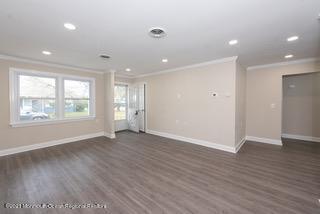 6 Churchill Road Whiting, NJ 08759 - Photo 4 of 30 an empty room with wooden floor and windows