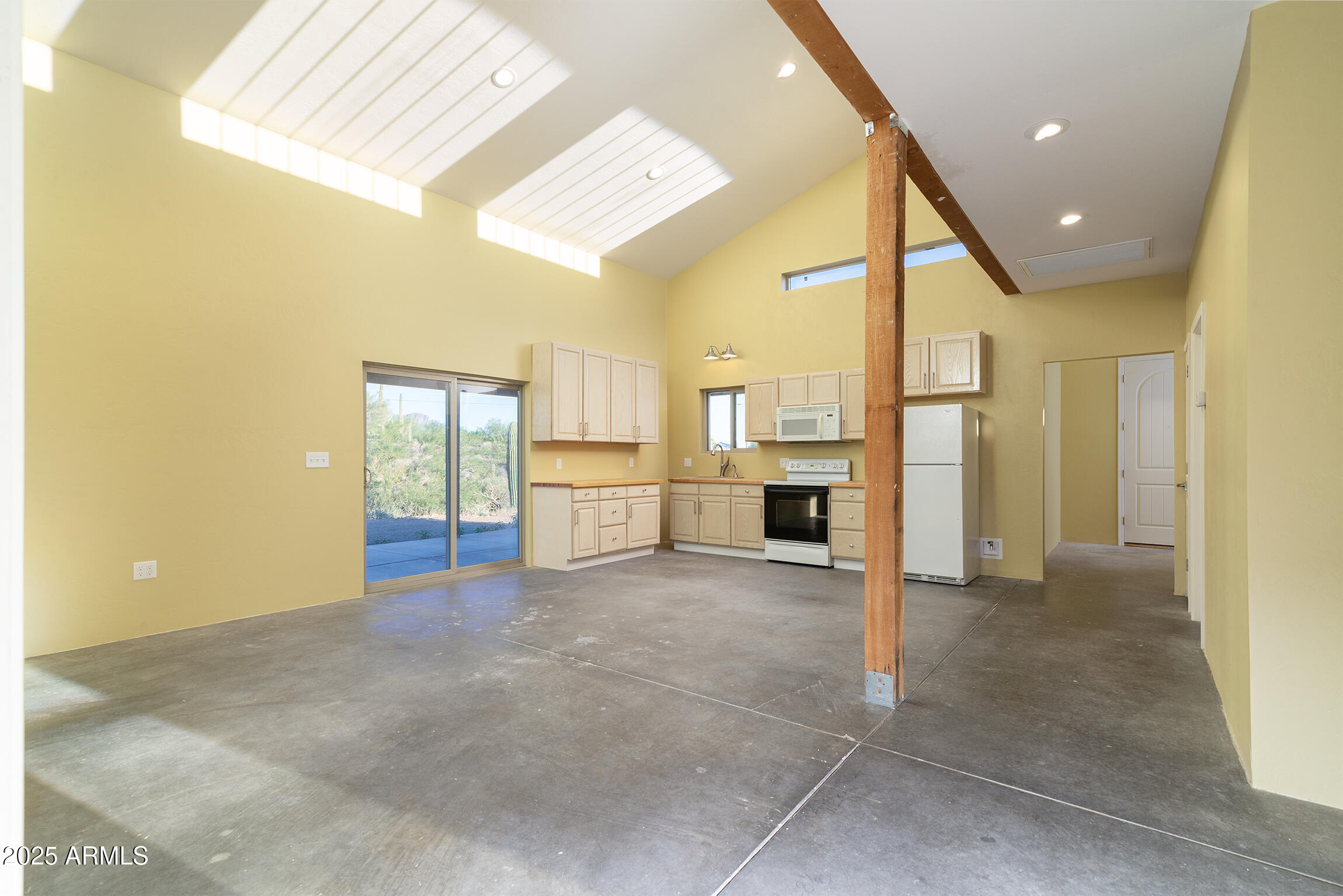 4129 East Roundup Street Apache Junction, AZ 85119 - Photo 11 of 42 a view of a kitchen with a sink and a refrigerator
