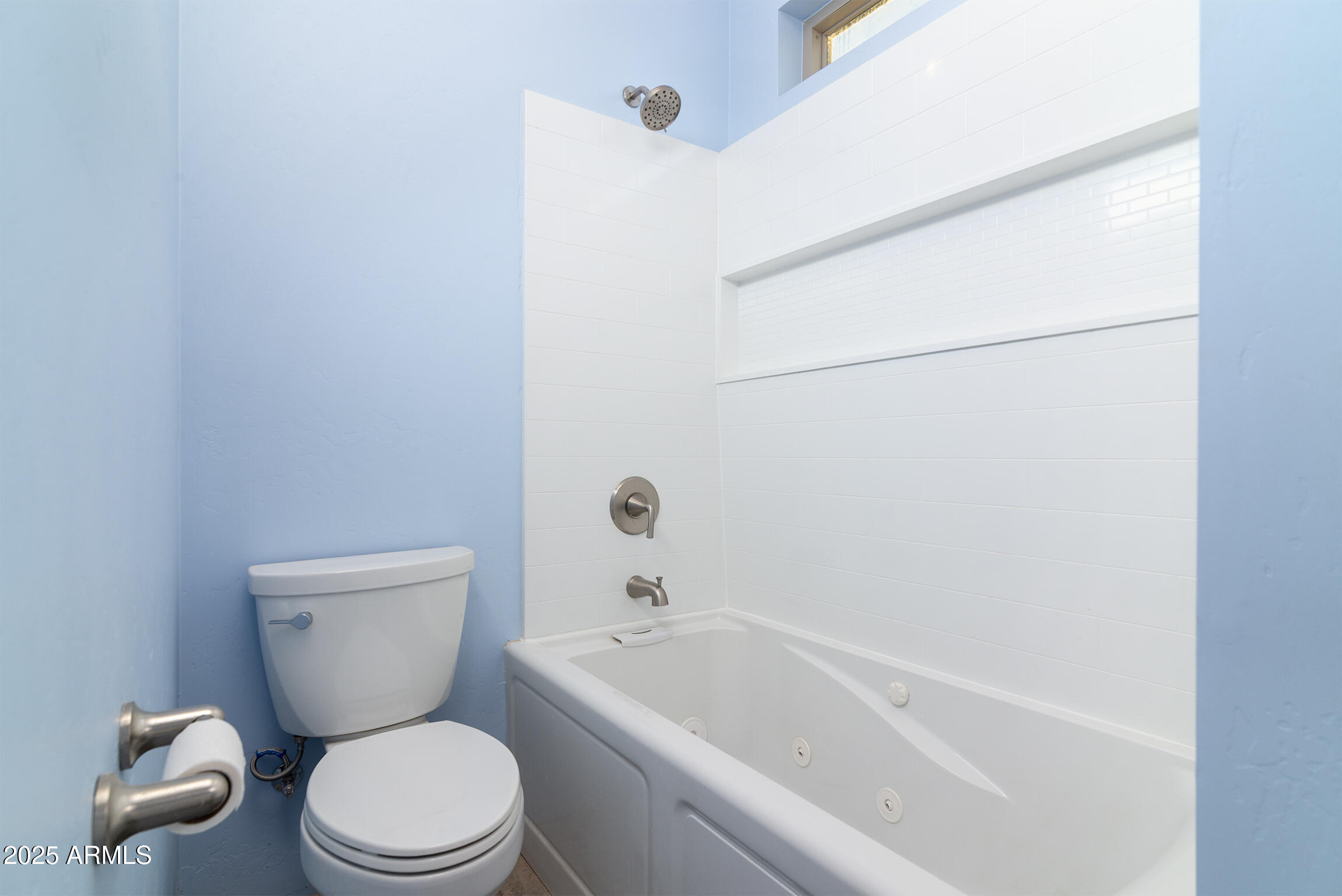 4129 East Roundup Street Apache Junction, AZ 85119 - Photo 18 of 42 a white toilet sitting next to a bath tub