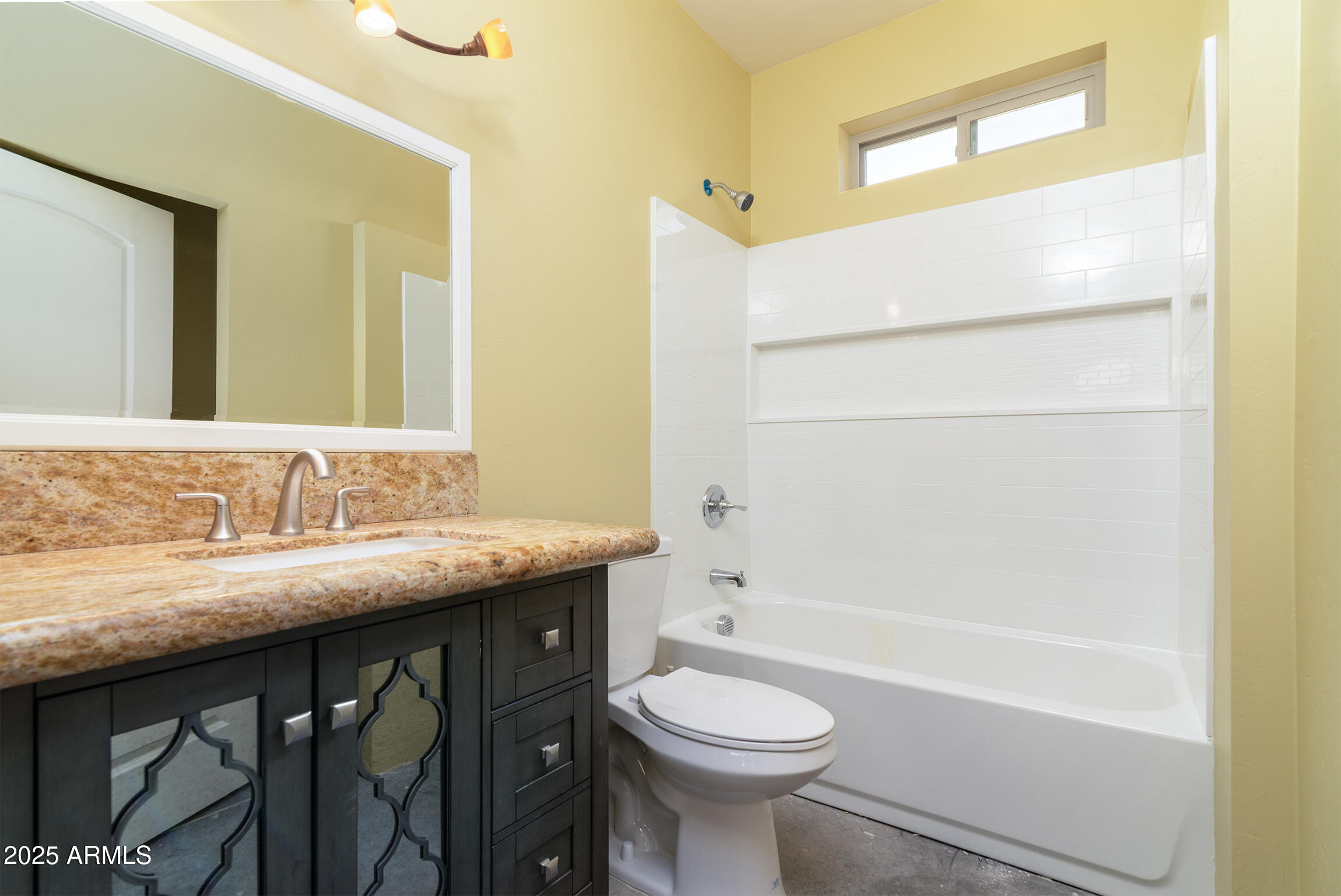 4129 East Roundup Street Apache Junction, AZ 85119 - Photo 22 of 42 a bathroom with a granite countertop sink a toilet and bathtub