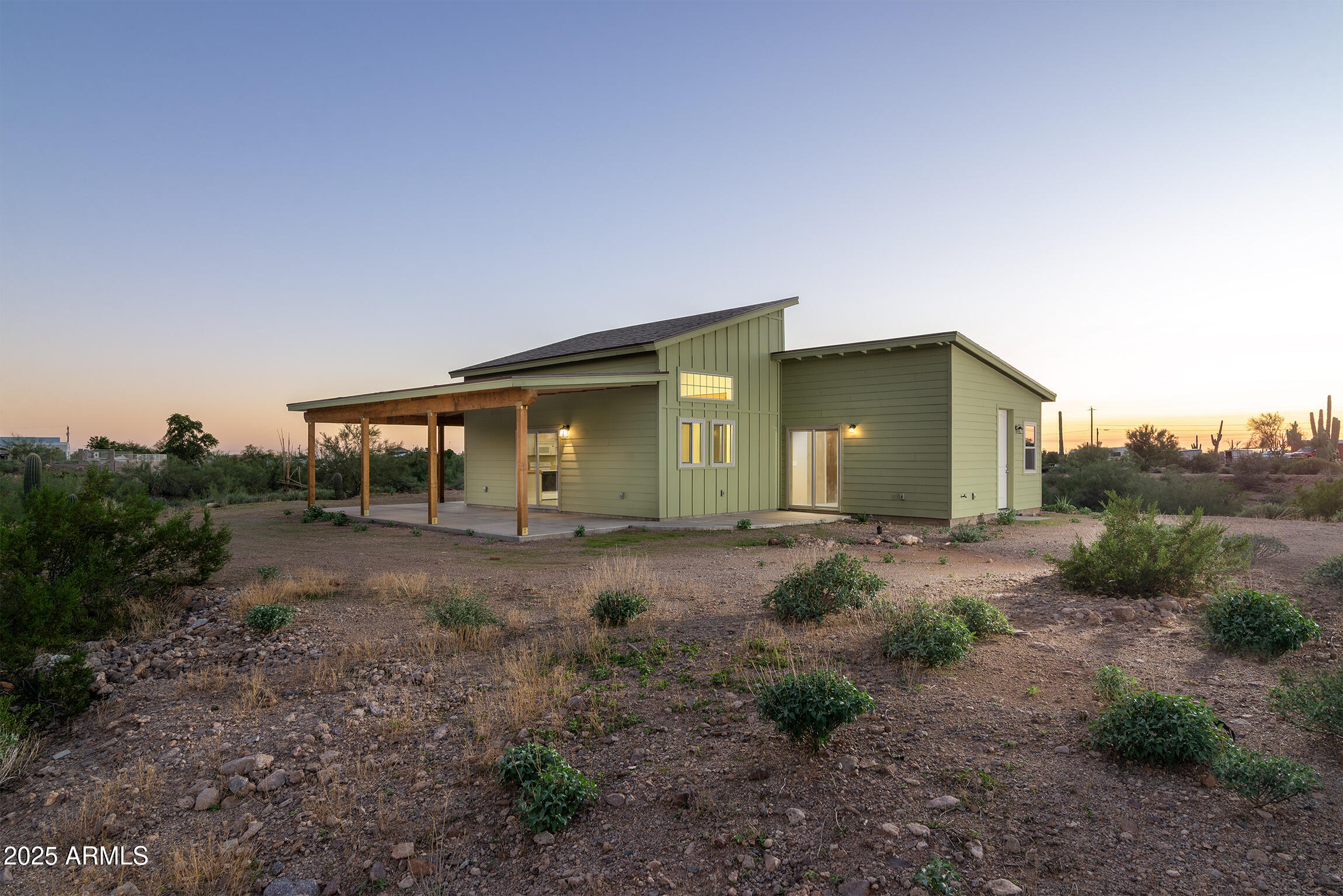 4129 East Roundup Street Apache Junction, AZ 85119 - Photo 3 of 42 a view of a house with backyard and garden