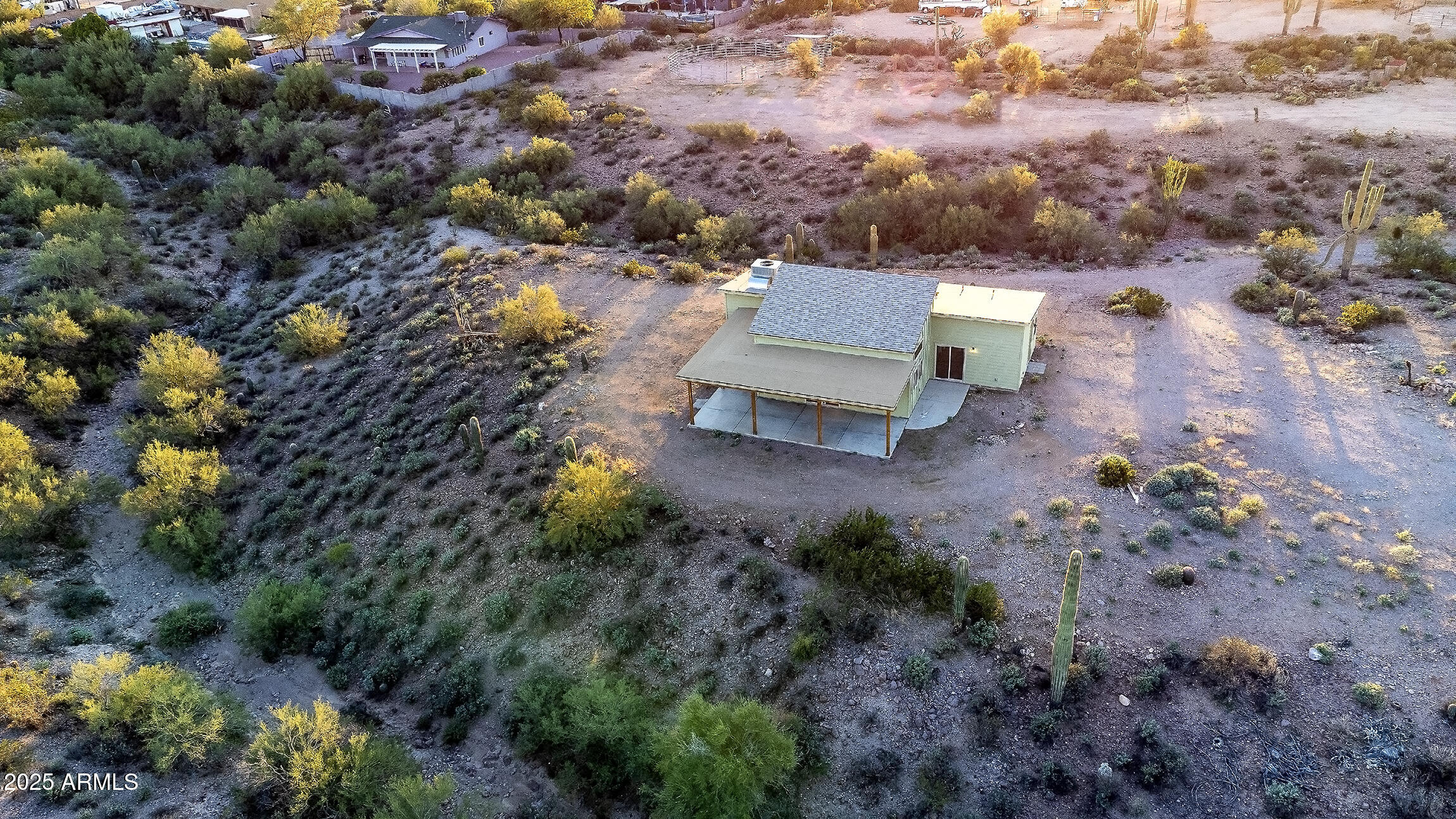 4129 East Roundup Street Apache Junction, AZ 85119 - Photo 32 of 42 an aerial view of a house with a yard and lake view in back