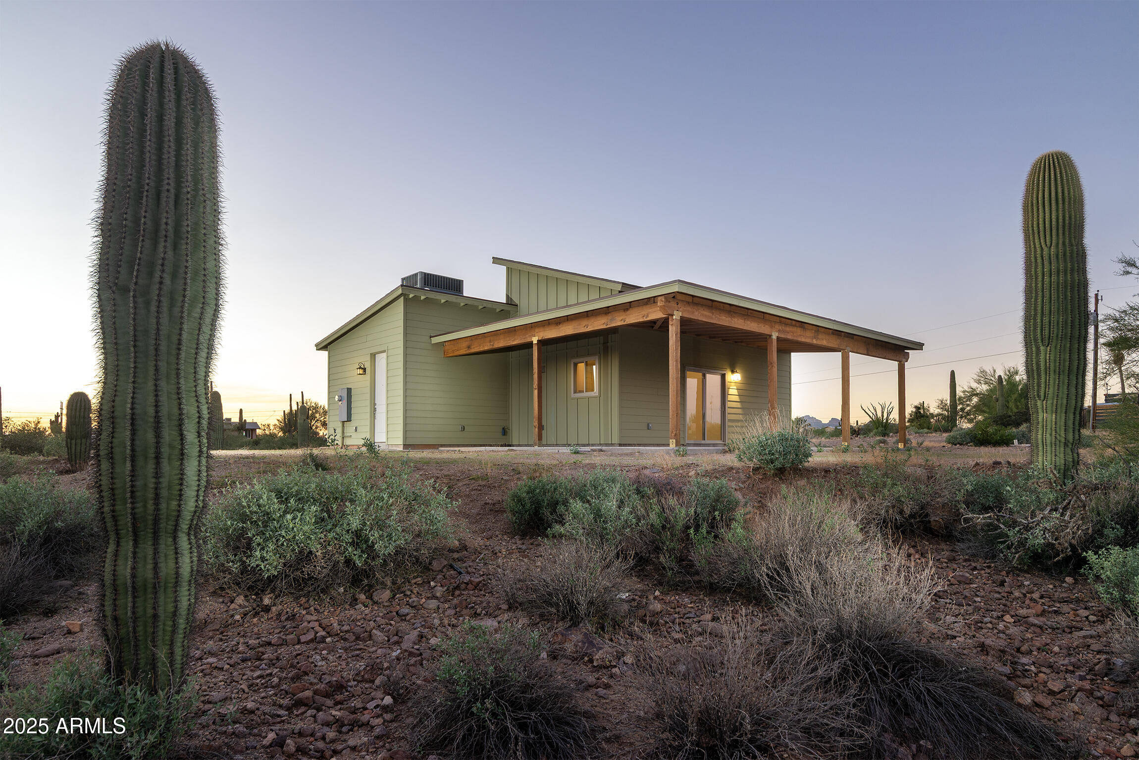 4129 East Roundup Street Apache Junction, AZ 85119 - Photo 4 of 42 a view of a house with backyard and trees