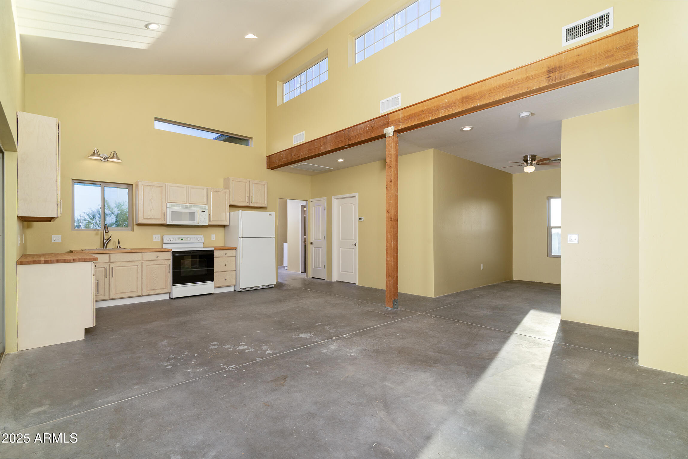 4129 East Roundup Street Apache Junction, AZ 85119 - Photo 9 of 42 a view of a kitchen with a sink and a fireplace