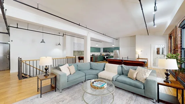 a living room with furniture and a table