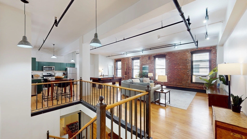 19 Stanhope Street, Unit 1C Boston, MA 02116 - Photo 10 of 19 a view of a livingroom with furniture wooden floor and windows
