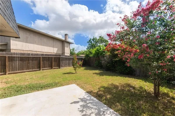 a backyard of a house with lots of green space