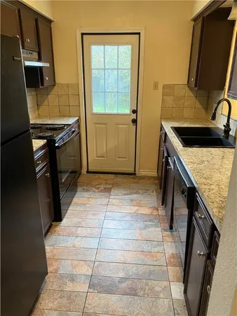 a view of a kitchen from the kitchen