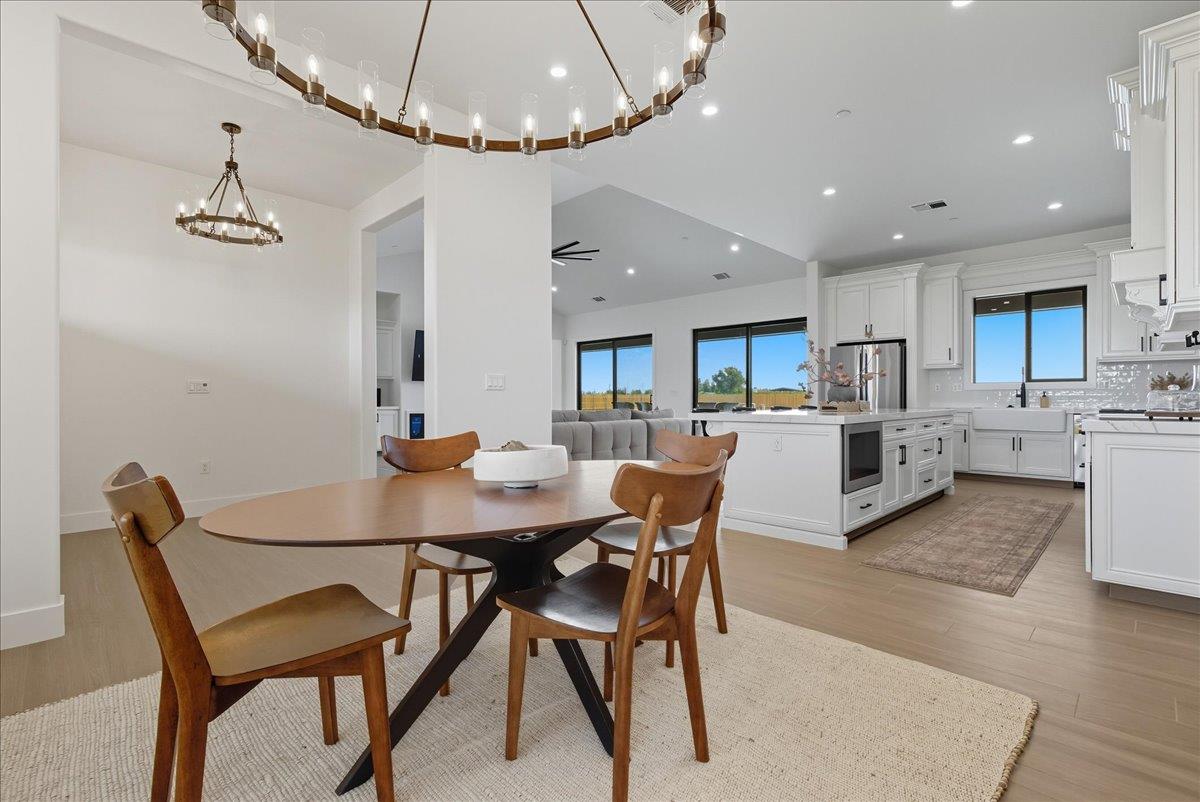 605 South Anderson Road Exeter, CA 93221 - Photo 18 of 81 a view of a dining room with furniture and a chandelier