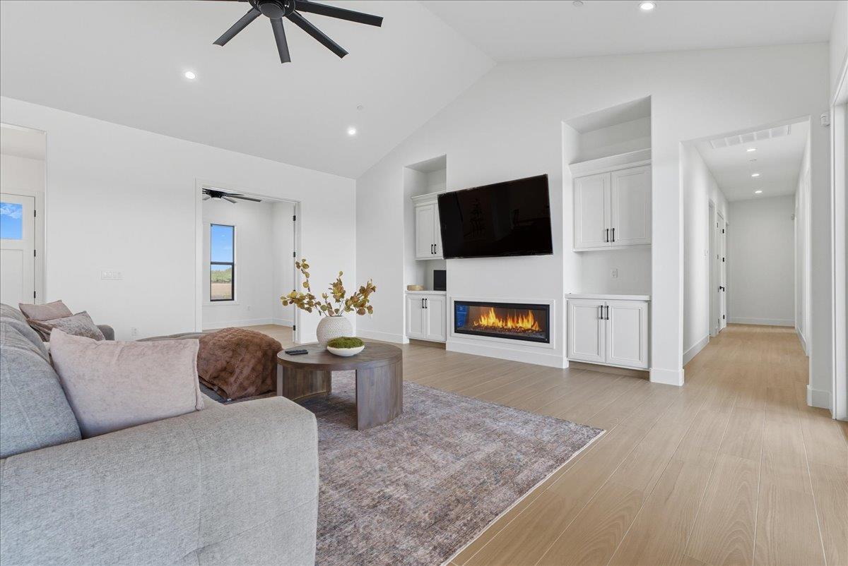 605 South Anderson Road Exeter, CA 93221 - Photo 31 of 81 a living room with furniture and a flat screen tv