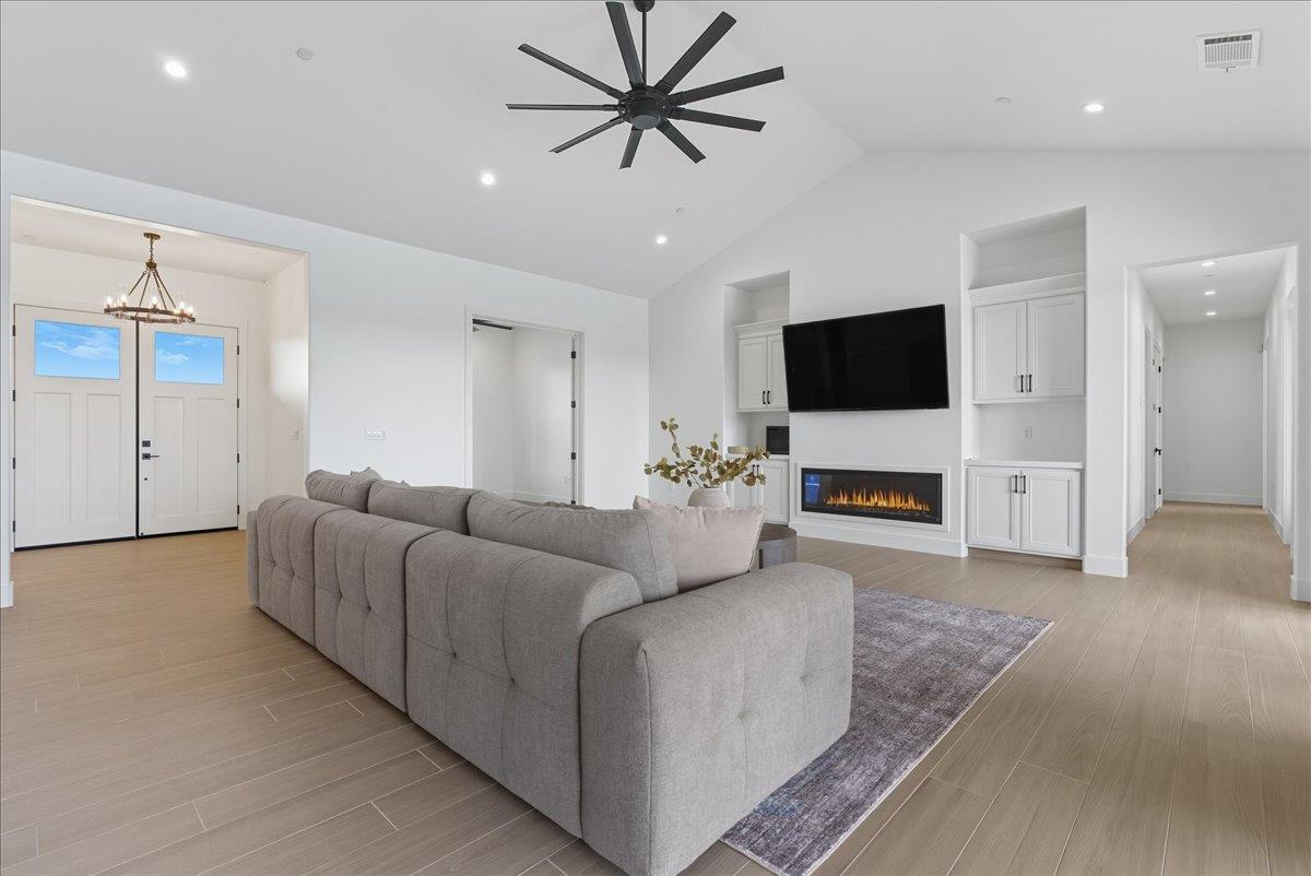 605 South Anderson Road Exeter, CA 93221 - Photo 32 of 81 a living room with furniture and a flat screen tv