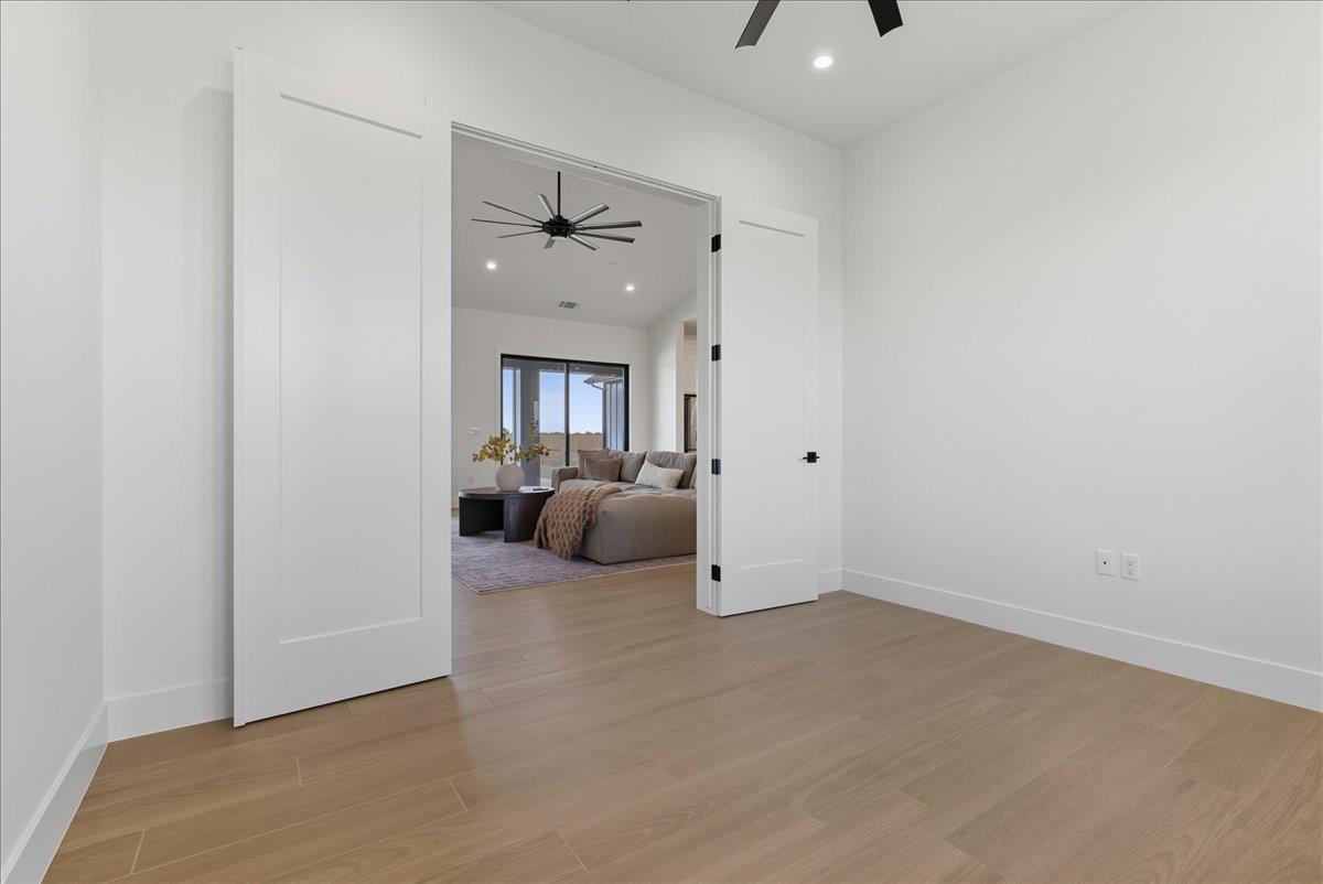 605 South Anderson Road Exeter, CA 93221 - Photo 34 of 81 a view of a livingroom with a white furniture and a ceiling fan