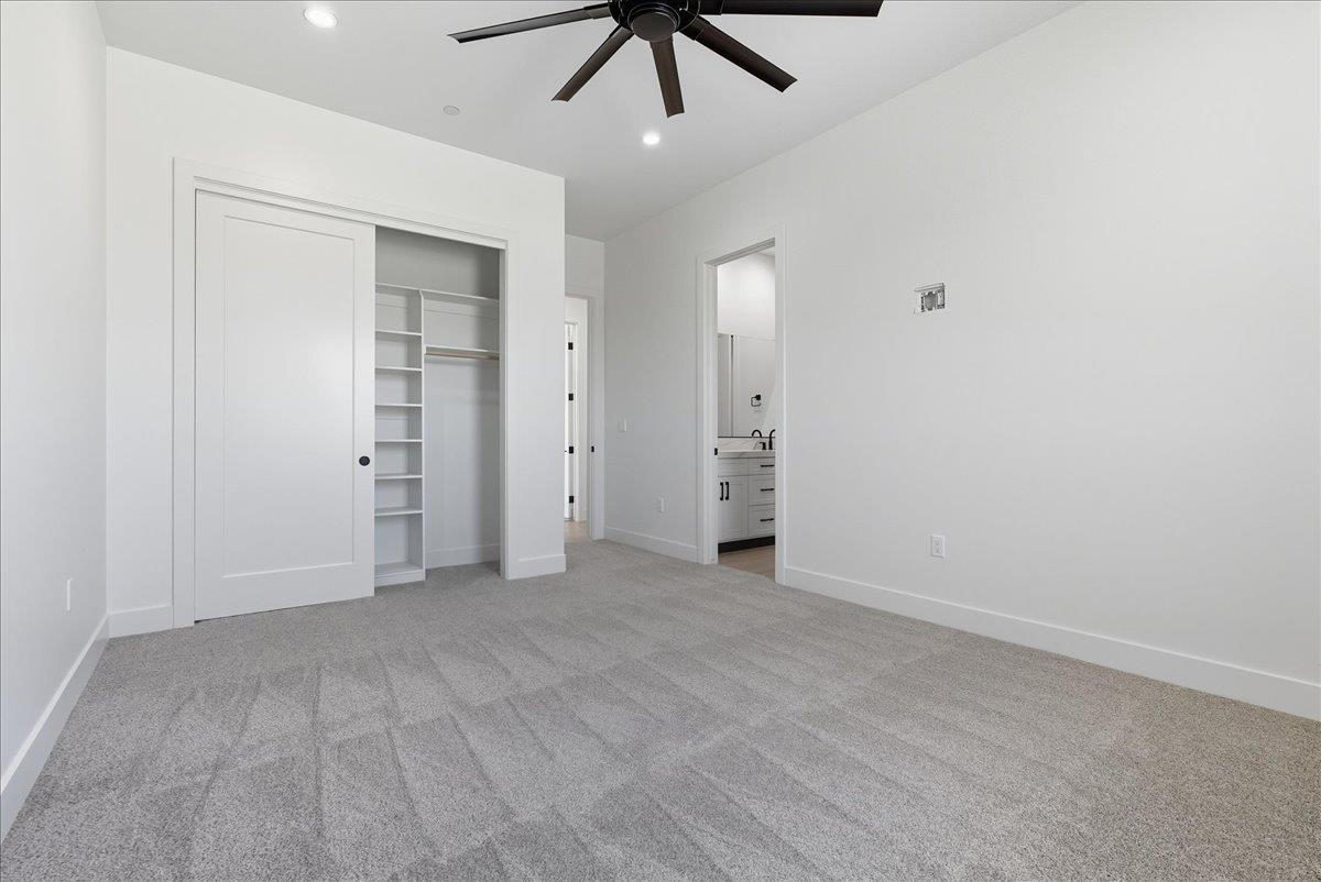 605 South Anderson Road Exeter, CA 93221 - Photo 40 of 81 an empty room with closet and chandelier fan