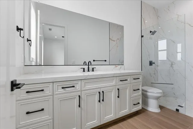 a view of a kitchen with a sink and a stove top oven