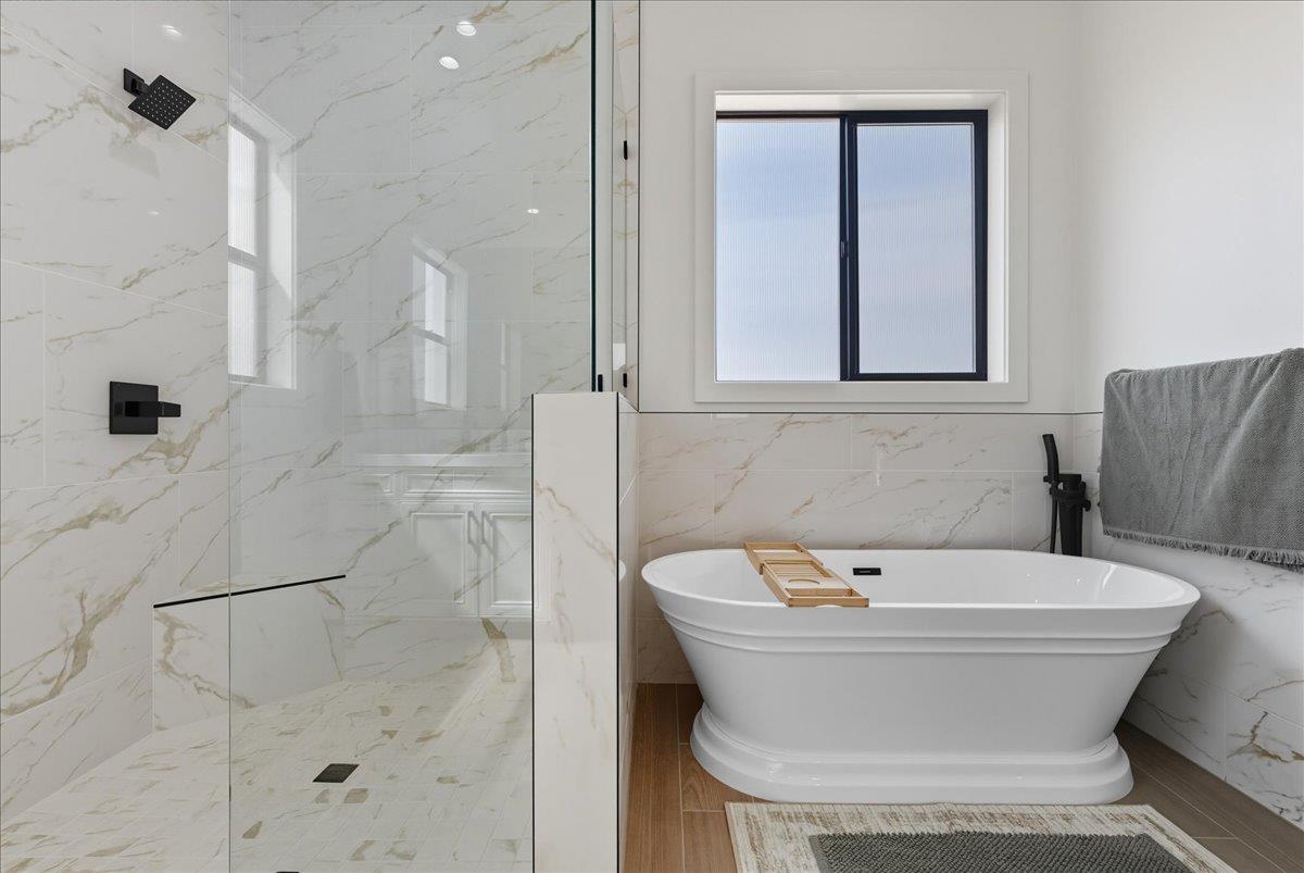 605 South Anderson Road Exeter, CA 93221 - Photo 54 of 81 a bathroom with a bathtub and shower