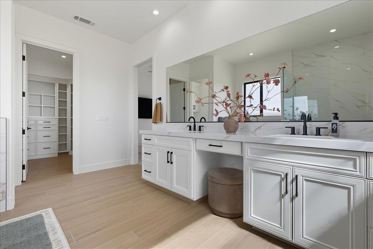605 South Anderson Road Exeter, CA 93221 - Photo 55 of 81 a spacious bathroom with a double vanity sink a mirror and a shower