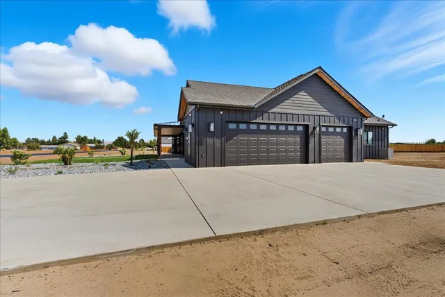 an aerial view of a house with a lake view