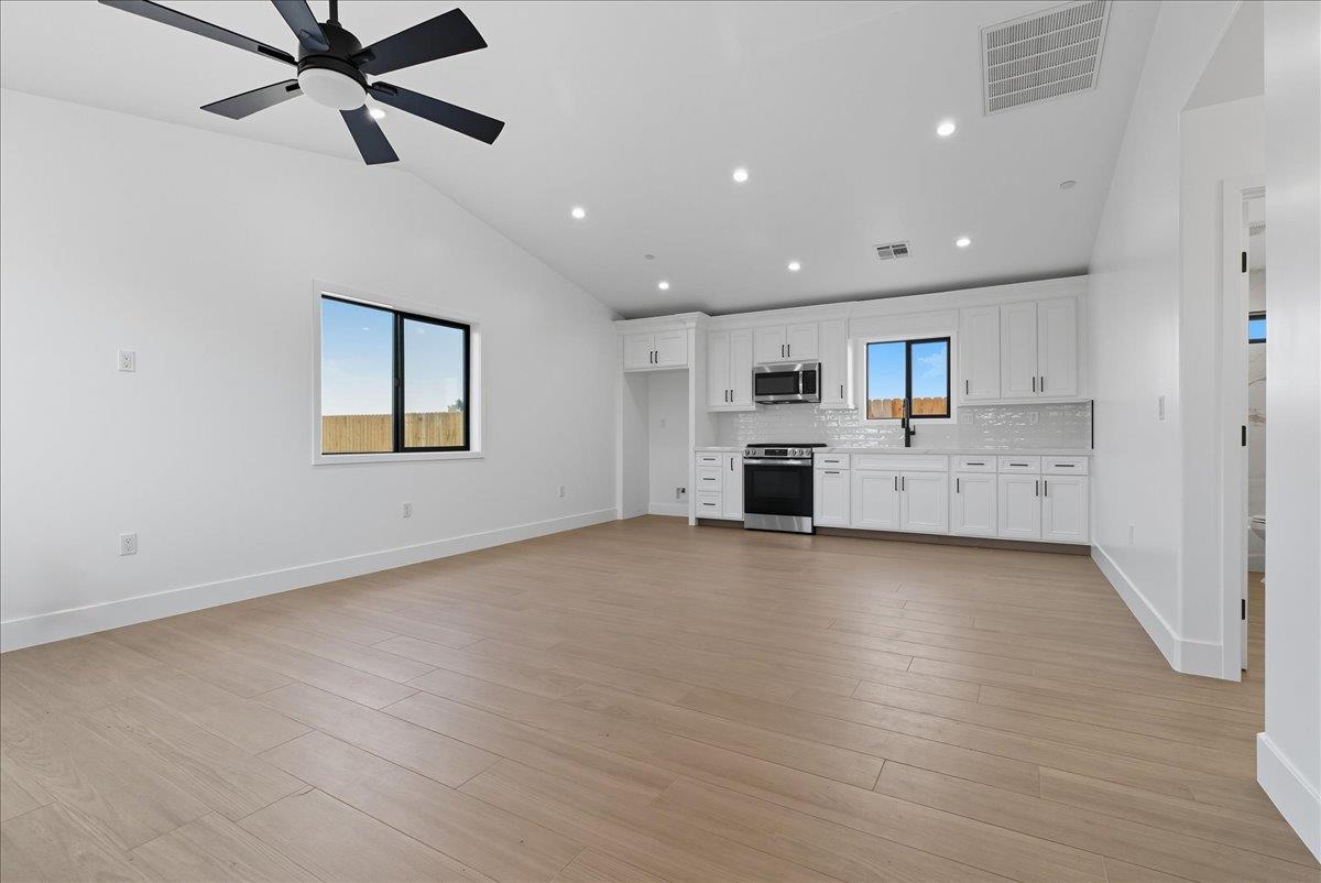 605 South Anderson Road Exeter, CA 93221 - Photo 70 of 81 a view of a kitchen with a sink and a stove top oven