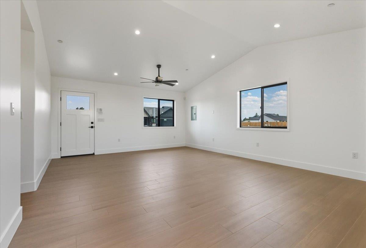 605 South Anderson Road Exeter, CA 93221 - Photo 71 of 81 an empty room with wooden floor cabinet and windows