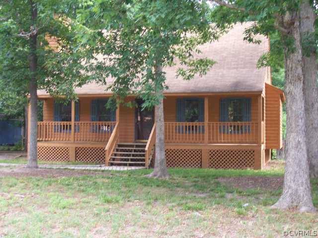 4008 Peregrine Road Richmond, VA 23237 - Photo 1 of 2 a front view of a house with a yard