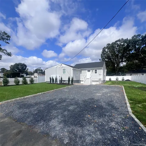 a view of a house with a yard and garage