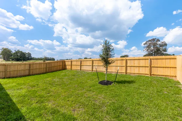 a view of yard with swimming pool