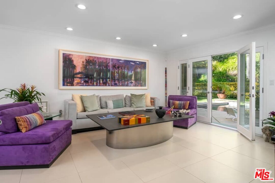 3104 Hutton Drive Beverly Hills, CA 90210 - Photo 12 of 37 a living room with furniture and a flat screen tv