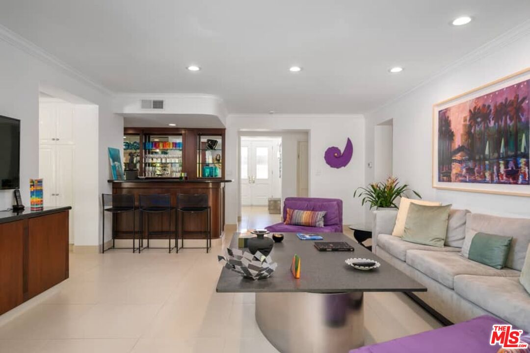 3104 Hutton Drive Beverly Hills, CA 90210 - Photo 13 of 37 a living room with furniture and a flat screen tv